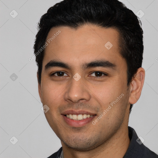 Joyful white young-adult male with short  black hair and brown eyes