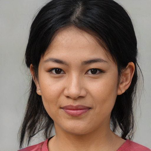 Joyful asian young-adult female with medium  brown hair and brown eyes