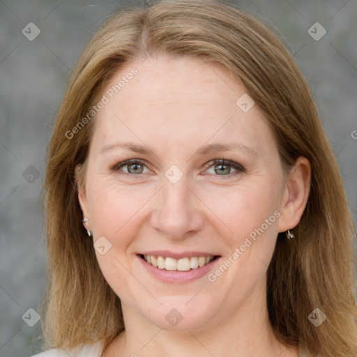 Joyful white adult female with medium  brown hair and grey eyes