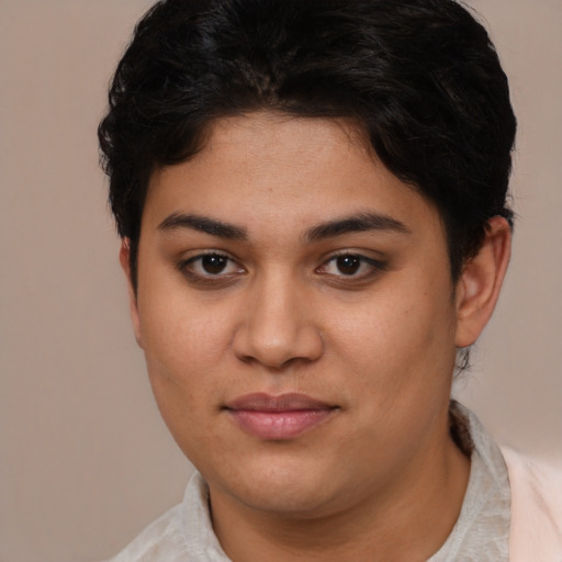 Joyful latino young-adult female with short  brown hair and brown eyes