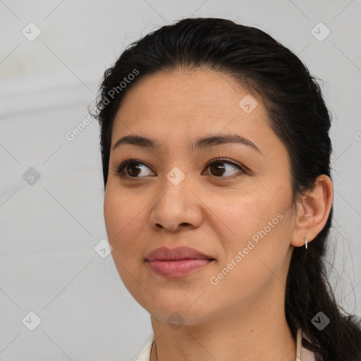 Joyful latino young-adult female with medium  brown hair and brown eyes