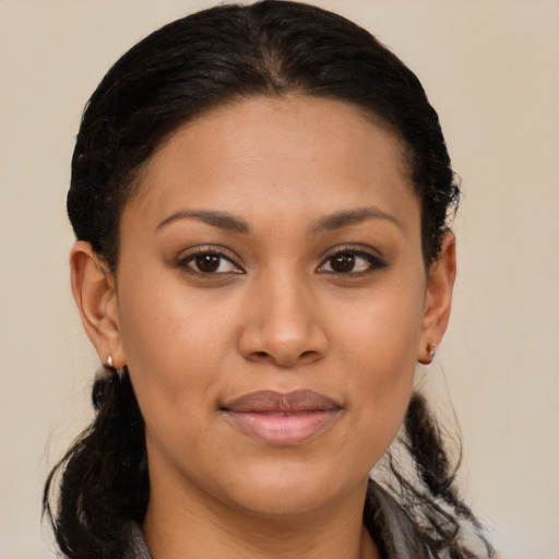 Joyful latino young-adult female with medium  brown hair and brown eyes