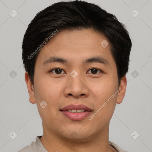 Joyful asian young-adult male with short  brown hair and brown eyes