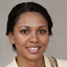 Joyful latino young-adult female with medium  brown hair and brown eyes