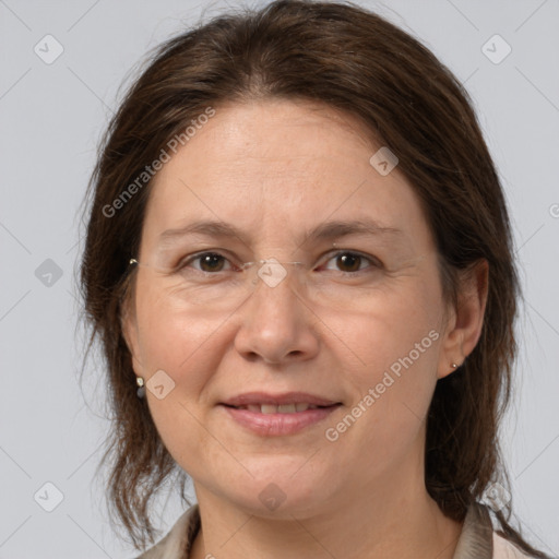 Joyful white adult female with medium  brown hair and brown eyes