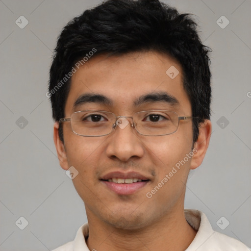 Joyful asian young-adult male with short  black hair and brown eyes