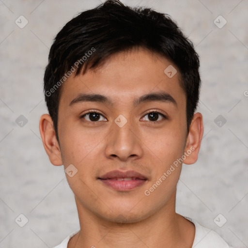 Joyful asian young-adult male with short  brown hair and brown eyes