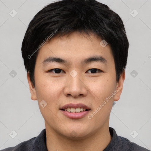 Joyful asian young-adult male with short  black hair and brown eyes