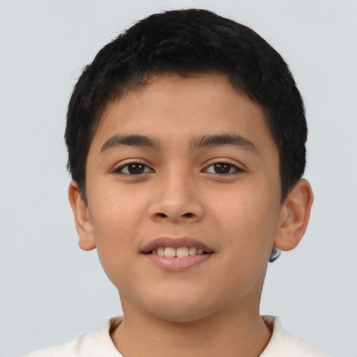 Joyful latino young-adult male with short  brown hair and brown eyes
