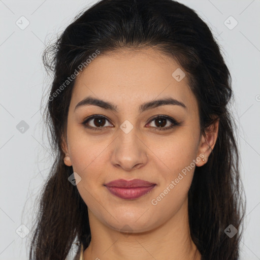 Joyful latino young-adult female with long  brown hair and brown eyes