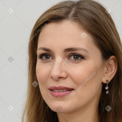 Joyful white adult female with long  brown hair and brown eyes