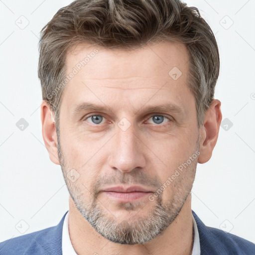 Neutral white adult male with short  brown hair and grey eyes