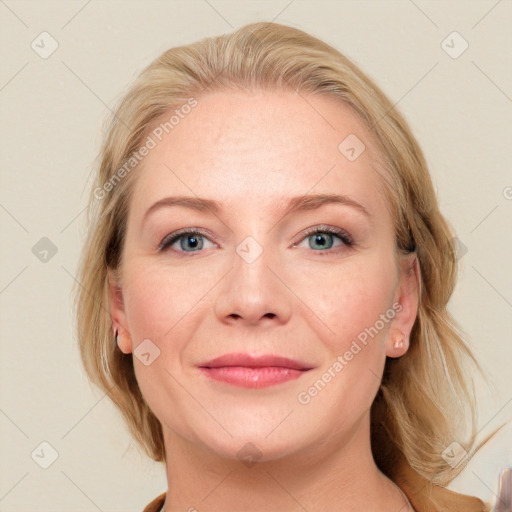 Joyful white adult female with medium  brown hair and blue eyes