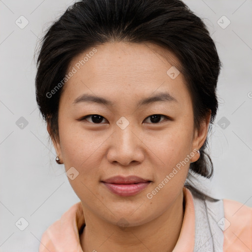 Joyful asian young-adult female with medium  brown hair and brown eyes