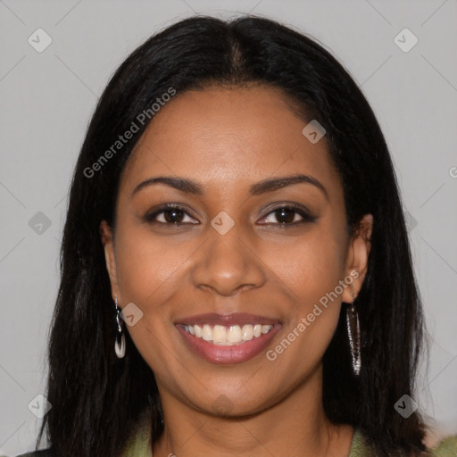 Joyful black young-adult female with long  black hair and brown eyes