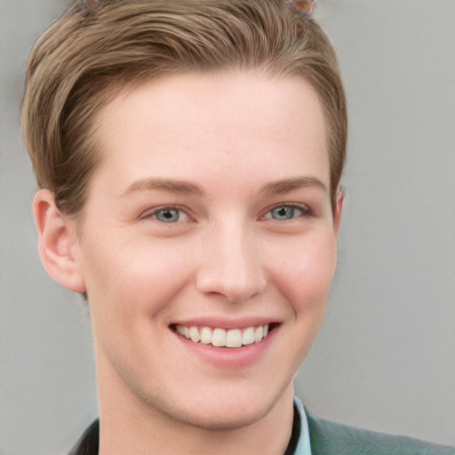 Joyful white young-adult female with short  brown hair and grey eyes