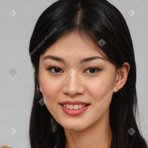 Joyful asian young-adult female with long  brown hair and brown eyes