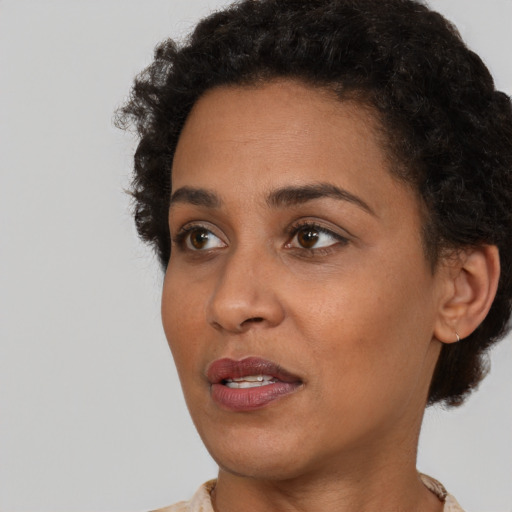 Neutral black young-adult female with short  brown hair and brown eyes