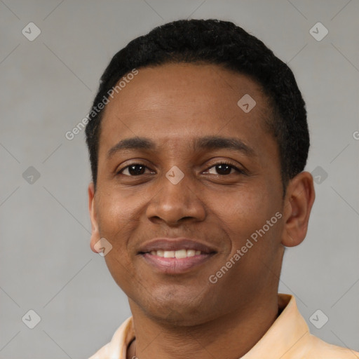 Joyful latino young-adult male with short  black hair and brown eyes