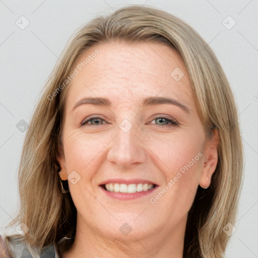 Joyful white adult female with long  brown hair and grey eyes