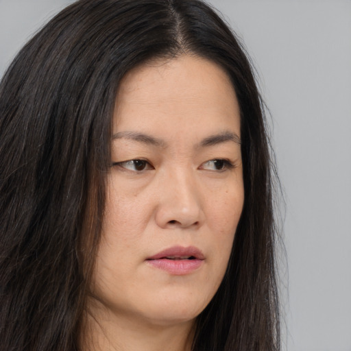 Neutral asian young-adult female with long  brown hair and brown eyes