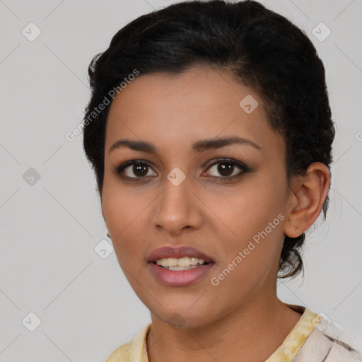 Joyful latino young-adult female with short  black hair and brown eyes