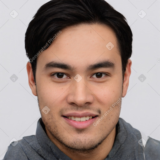 Joyful asian young-adult male with short  black hair and brown eyes