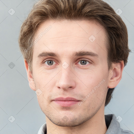 Neutral white young-adult male with short  brown hair and grey eyes