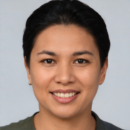 Joyful white young-adult female with short  black hair and brown eyes