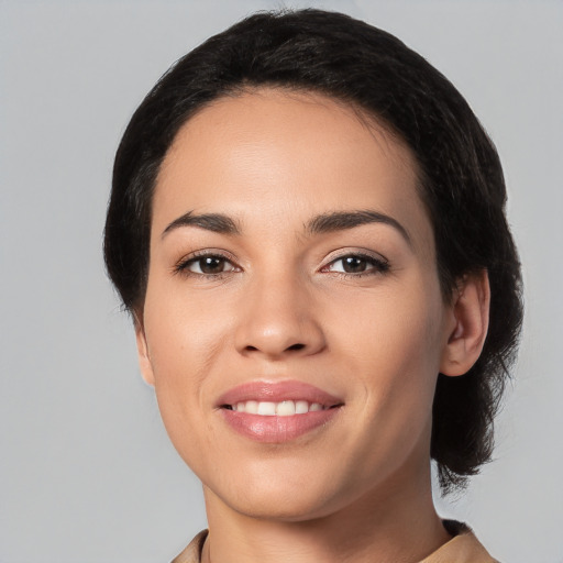 Joyful white young-adult female with medium  black hair and brown eyes