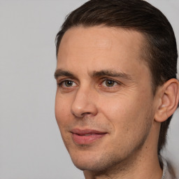 Joyful white adult male with short  brown hair and brown eyes