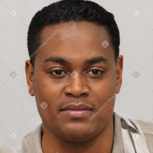 Joyful black young-adult male with short  black hair and brown eyes