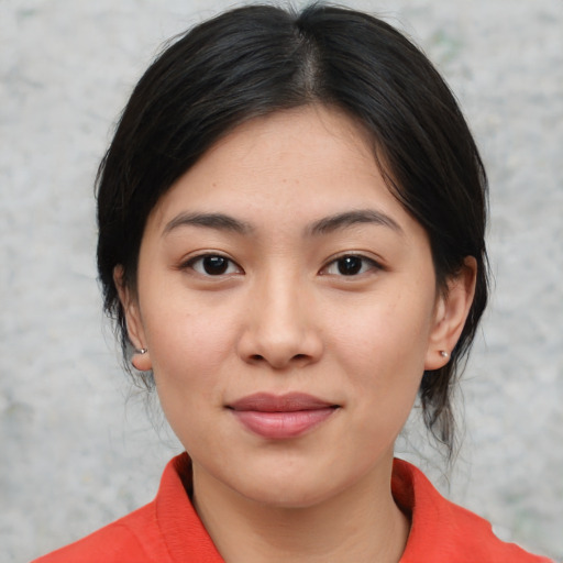 Joyful white young-adult female with medium  black hair and brown eyes