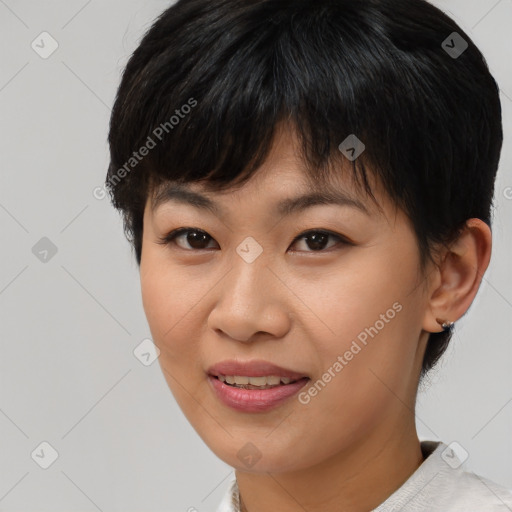 Joyful asian young-adult female with short  brown hair and brown eyes