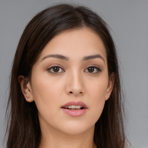 Joyful white young-adult female with long  brown hair and brown eyes