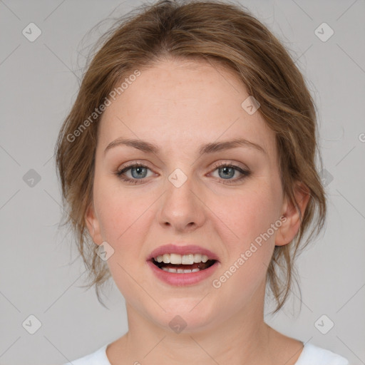 Joyful white young-adult female with medium  brown hair and blue eyes