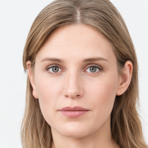 Joyful white young-adult female with long  brown hair and blue eyes