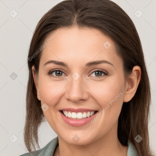 Joyful white young-adult female with long  brown hair and grey eyes