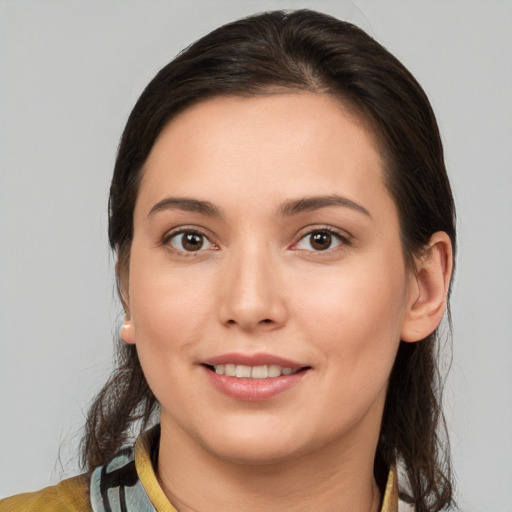 Joyful white young-adult female with medium  brown hair and brown eyes