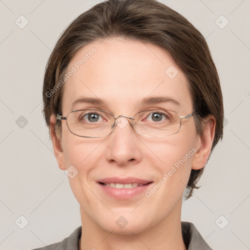 Joyful white adult female with medium  brown hair and grey eyes