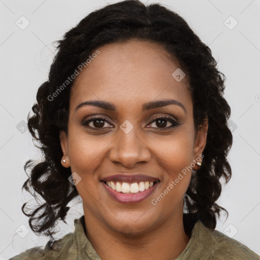 Joyful black young-adult female with long  brown hair and brown eyes