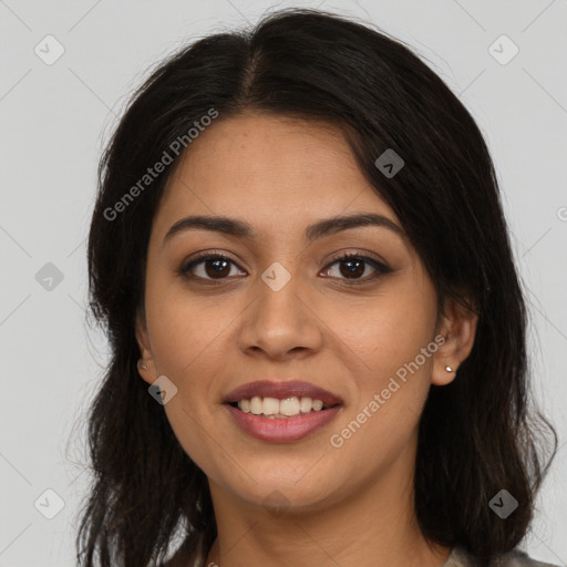 Joyful latino young-adult female with long  brown hair and brown eyes