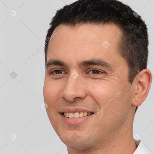 Joyful white young-adult male with short  brown hair and brown eyes