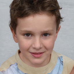 Joyful white child male with short  brown hair and brown eyes