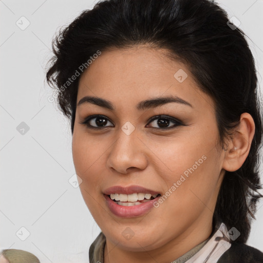 Joyful latino young-adult female with medium  brown hair and brown eyes