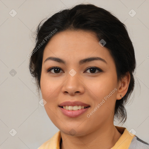 Joyful latino young-adult female with medium  brown hair and brown eyes