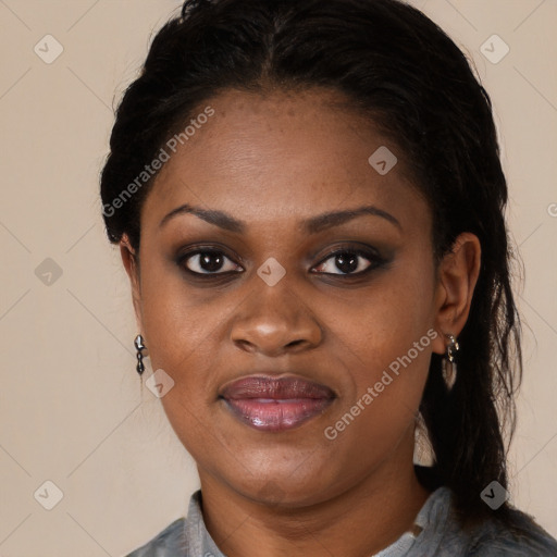 Joyful black young-adult female with long  black hair and brown eyes