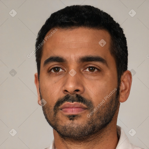 Neutral latino young-adult male with short  black hair and brown eyes