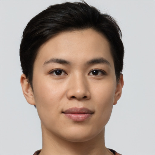 Joyful asian young-adult female with short  brown hair and brown eyes