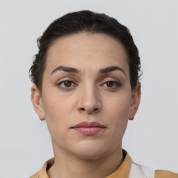 Neutral white young-adult female with short  brown hair and brown eyes